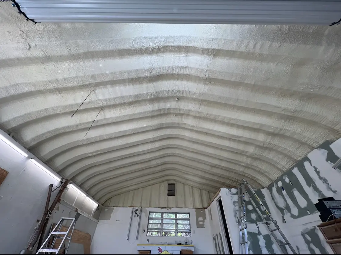 Spray polyurethane foam applied to the underside of a metal roof deck in Wooster